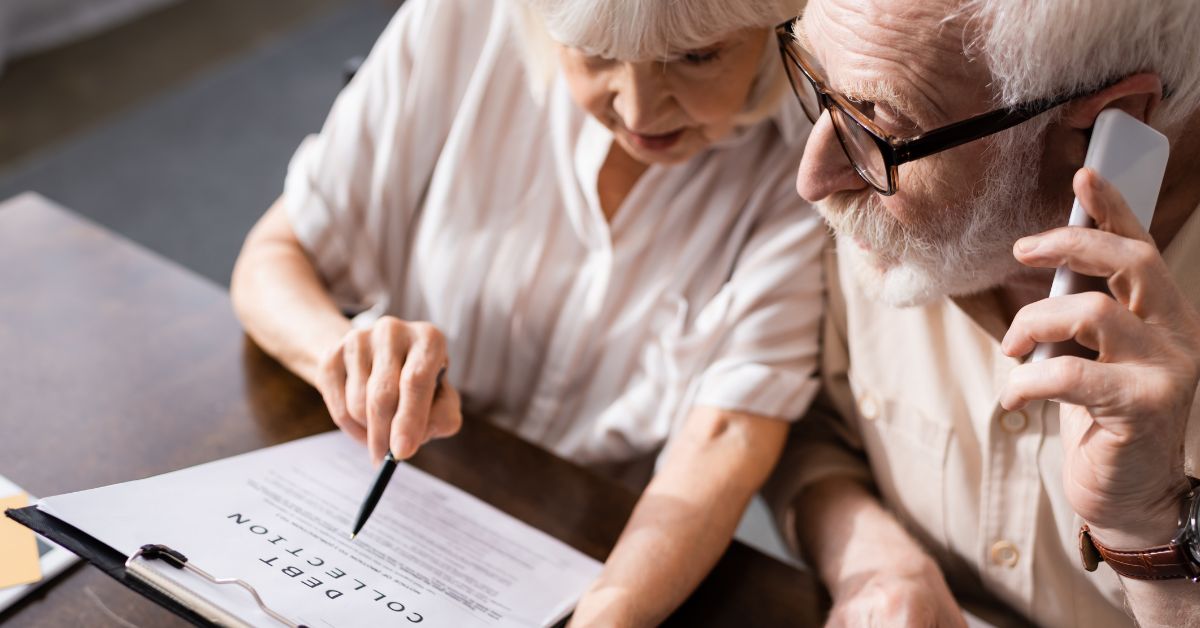 older couple on the phone dealing with debt