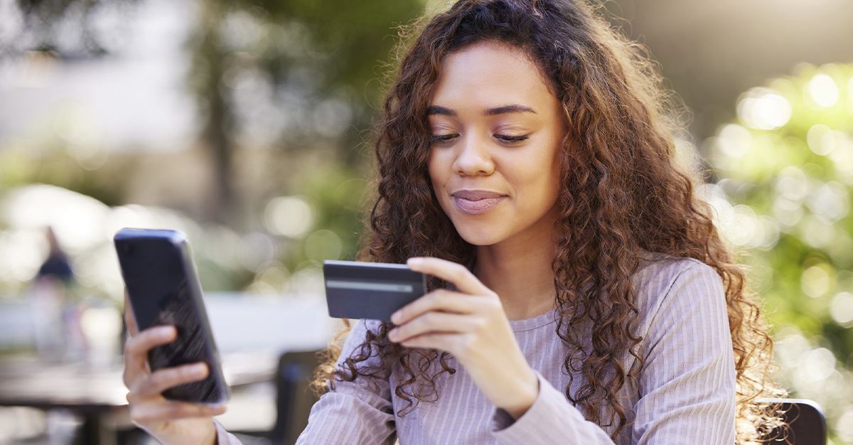 Young female adult with a credit card